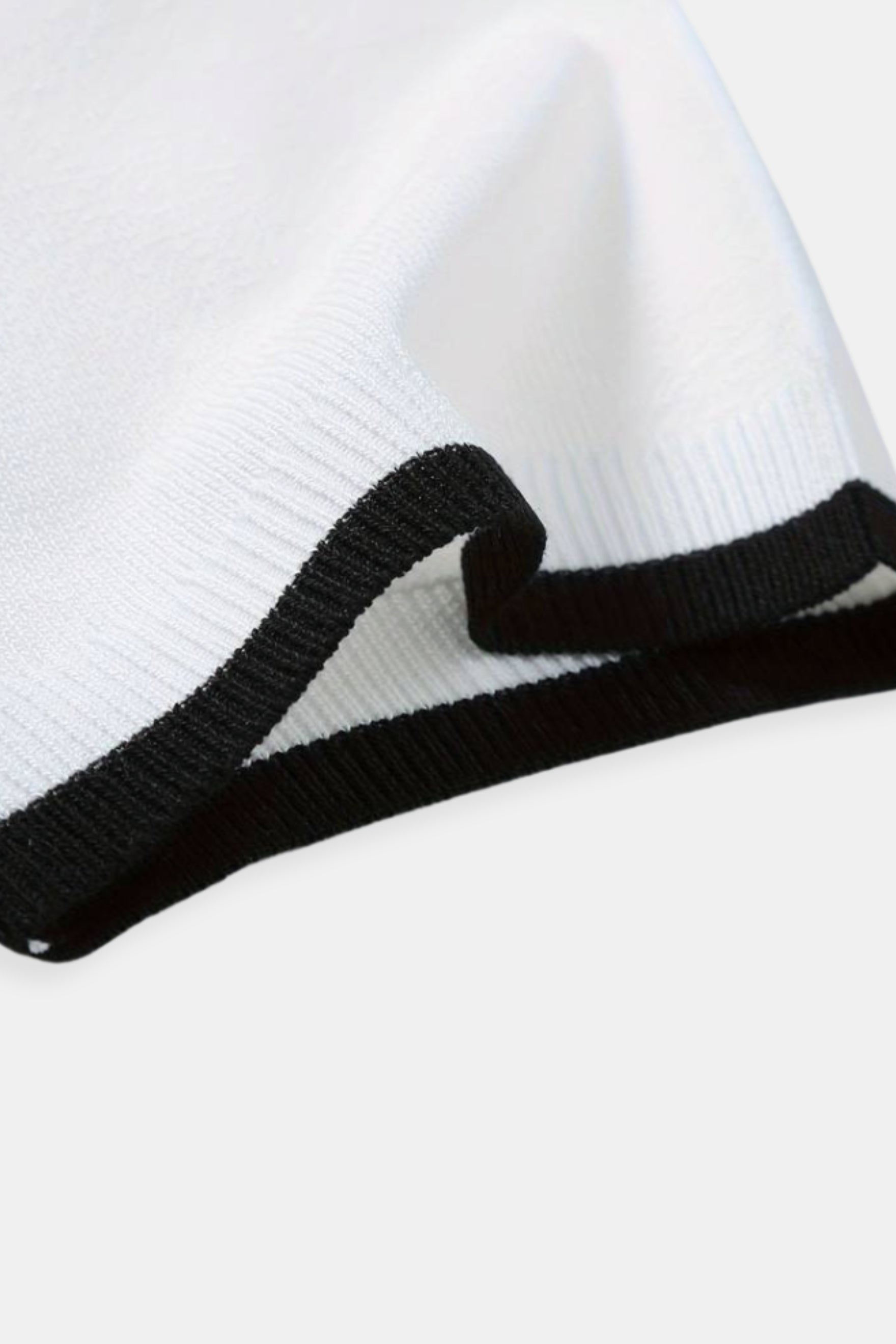 Polo de golf en tricot à zip quart