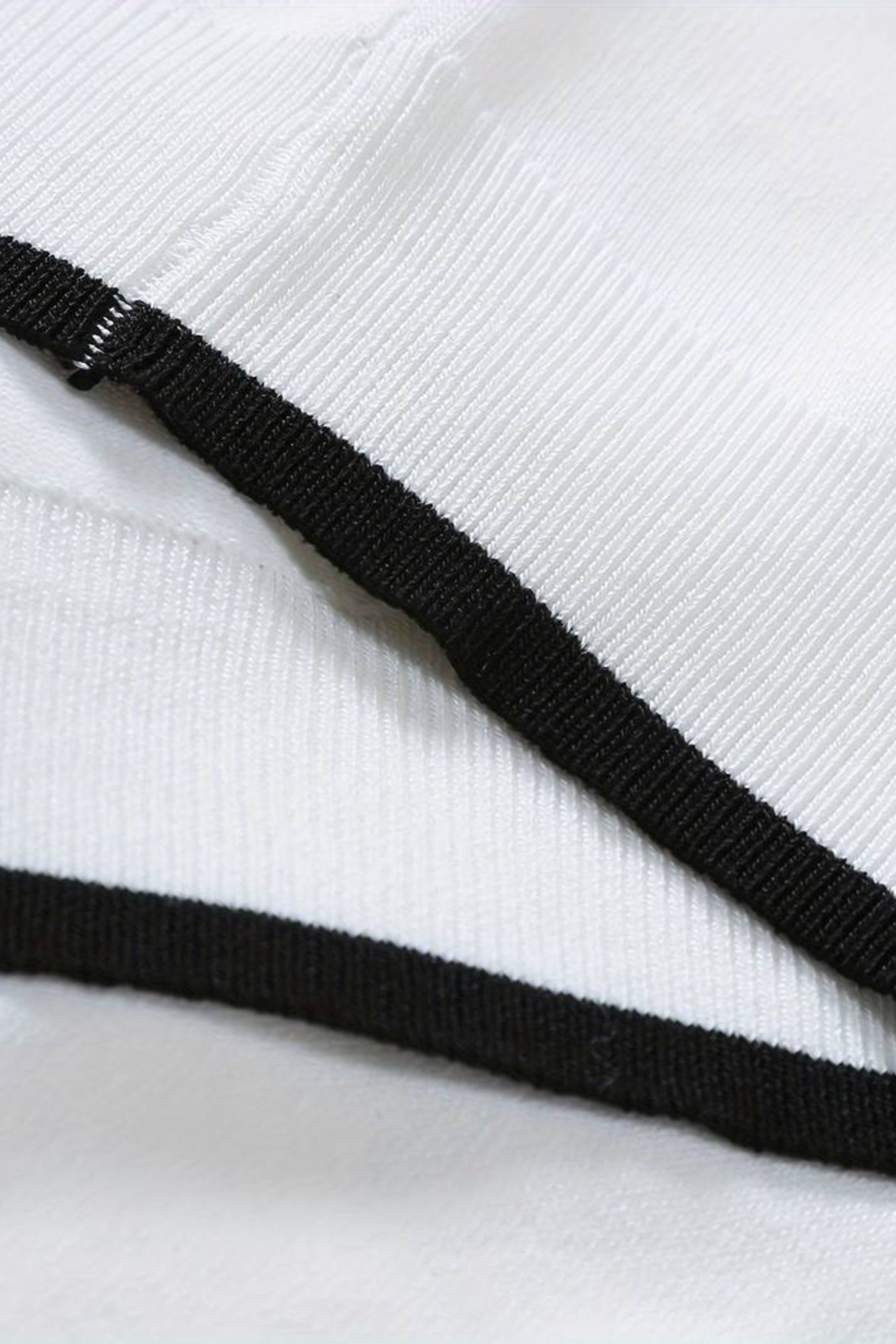 Polo de golf en tricot à zip quart